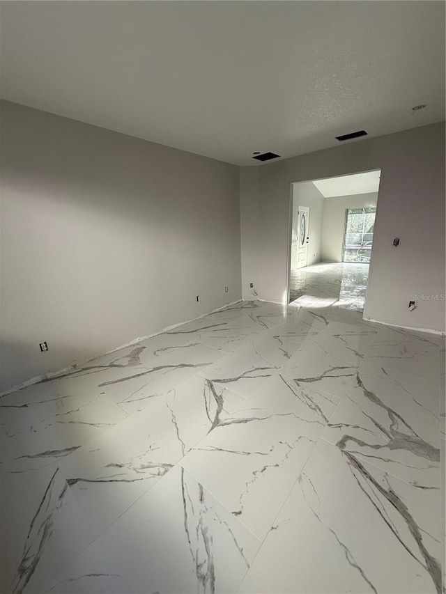 14273 Nugent Cir, Spring Hill, FL 34609 - spare room with marble finish flooring