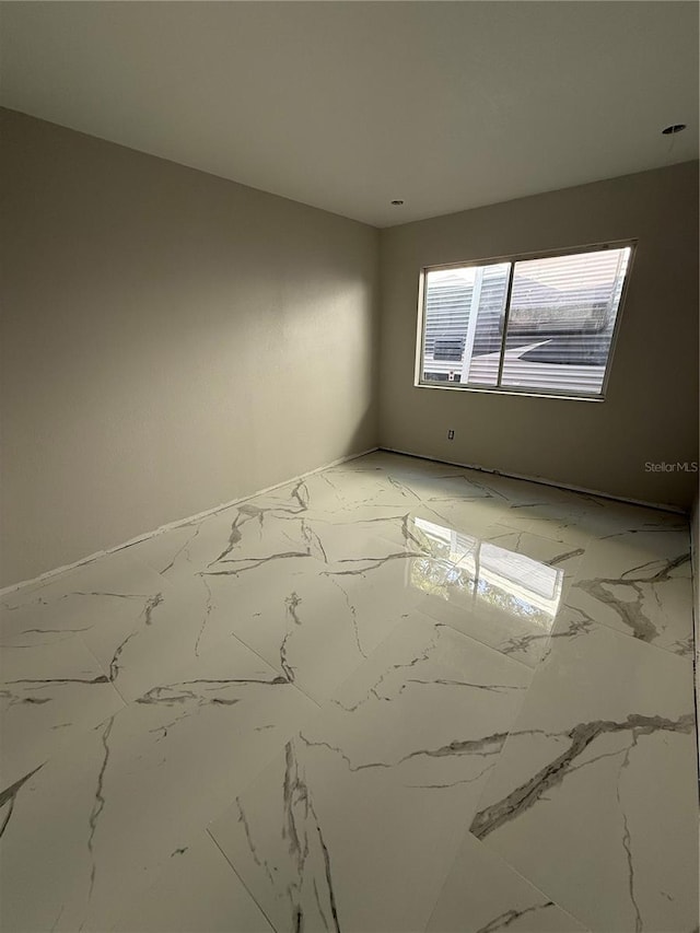 14273 Nugent Cir, Spring Hill, FL 34609 - unfurnished room featuring light marble finish floors