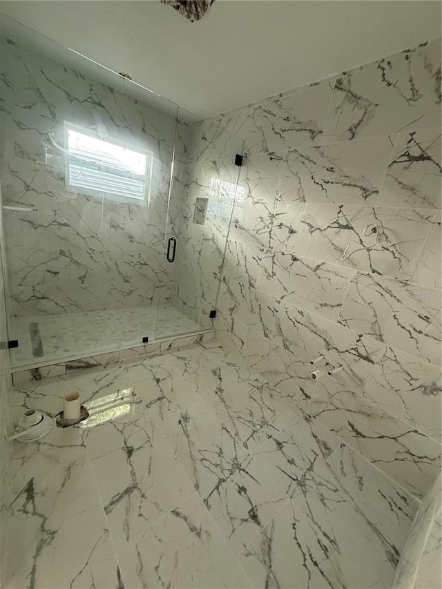 14273 Nugent Cir, Spring Hill, FL 34609 - bathroom featuring a marble finish shower and marble finish floors