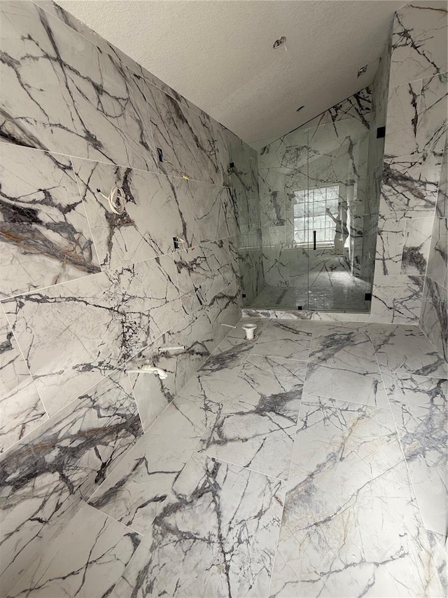 14273 Nugent Cir, Spring Hill, FL 34609 - full bath featuring vaulted ceiling, a marble finish shower, and a textured ceiling