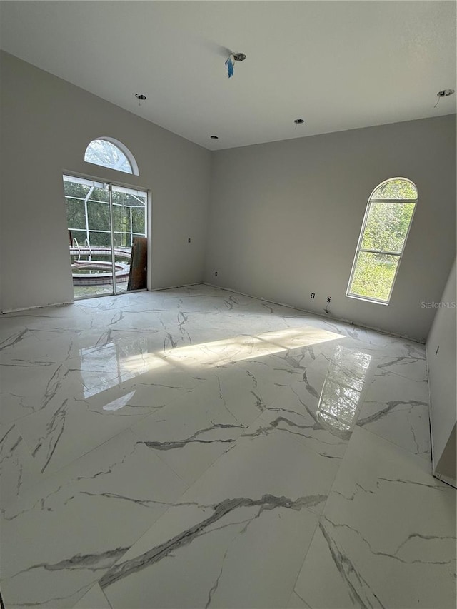 14273 Nugent Cir, Spring Hill, FL 34609 - empty room with light marble finish flooring