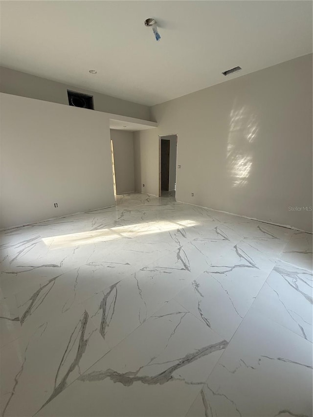14273 Nugent Cir, Spring Hill, FL 34609 - empty room featuring light marble finish flooring