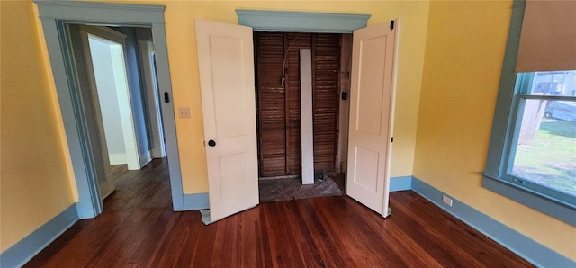 138 S Hernando Ave, Arcadia, FL 34266 - unfurnished bedroom with dark wood-style flooring and a closet