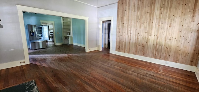 138 S Hernando Ave, Arcadia, FL 34266 - empty room with dark wood-style flooring and baseboards