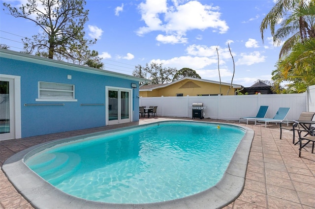 1818 Indian Rocks Rd S, Largo, FL 33774 - view of swimming pool with a patio, fence, and a grill