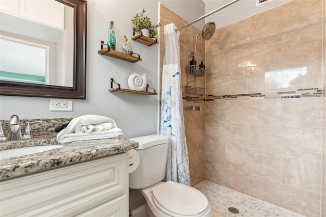 1818 Indian Rocks Rd S, Largo, FL 33774 - bathroom featuring a tile shower, toilet, and vanity