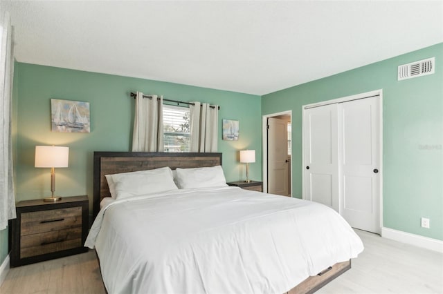 1818 Indian Rocks Rd S, Largo, FL 33774 - bedroom with light wood-style floors, baseboards, and a closet
