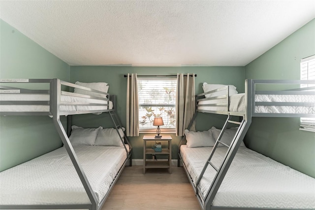 1818 Indian Rocks Rd S, Largo, FL 33774 - bedroom with wood finished floors and a textured ceiling