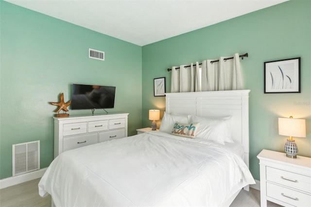1818 Indian Rocks Rd S, Largo, FL 33774 - bedroom featuring light wood-style floors and baseboards