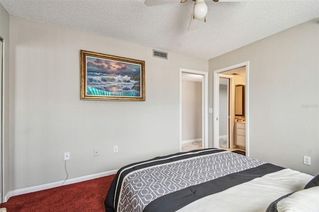 bedroom with carpet floors, a textured ceiling, baseboards, and ceiling fan