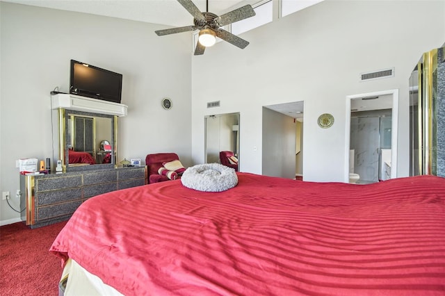 bedroom featuring a towering ceiling, carpet floors, and baseboards