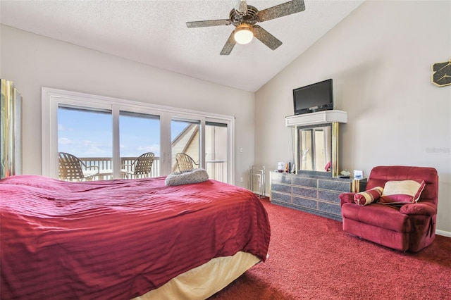 carpeted bedroom with access to exterior, lofted ceiling, a textured ceiling, and a ceiling fan