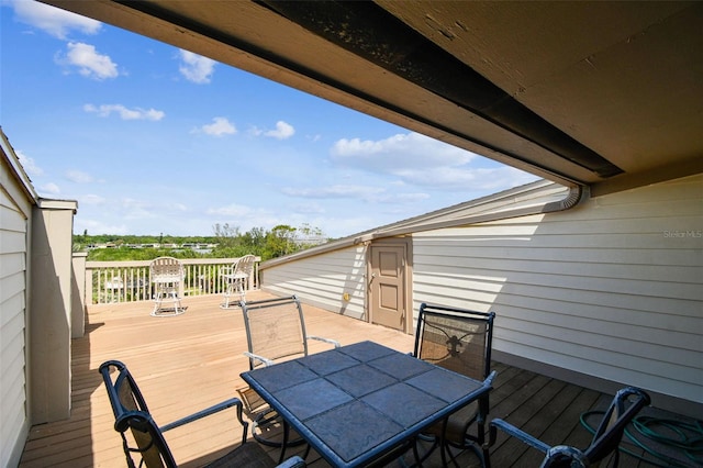 deck with outdoor dining area