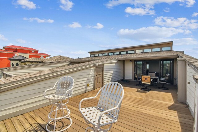 wooden deck with outdoor dining area