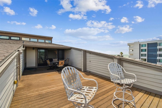 wooden deck with outdoor dining space