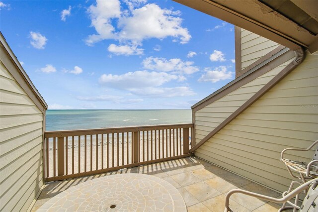 balcony featuring a water view
