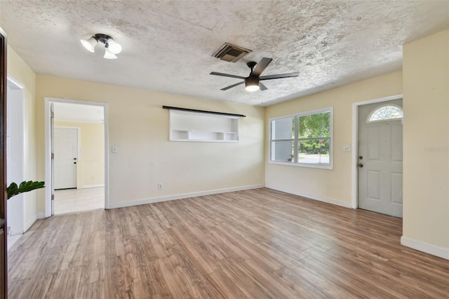 1810 77th Ave N, Saint Petersburg, FL 33702 - unfurnished room featuring wood finished floors, ceiling fan, and baseboards