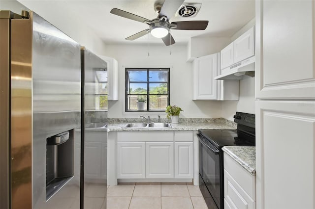 1810 77th Ave N, Saint Petersburg, FL 33702 - kitchen featuring black electric range, stainless steel fridge with ice dispenser, under cabinet range hood, a sink, and white cabinetry