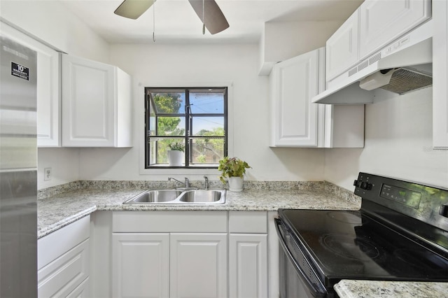 1810 77th Ave N, Saint Petersburg, FL 33702 - kitchen featuring electric range, a sink, under cabinet range hood, white cabinets, and ceiling fan