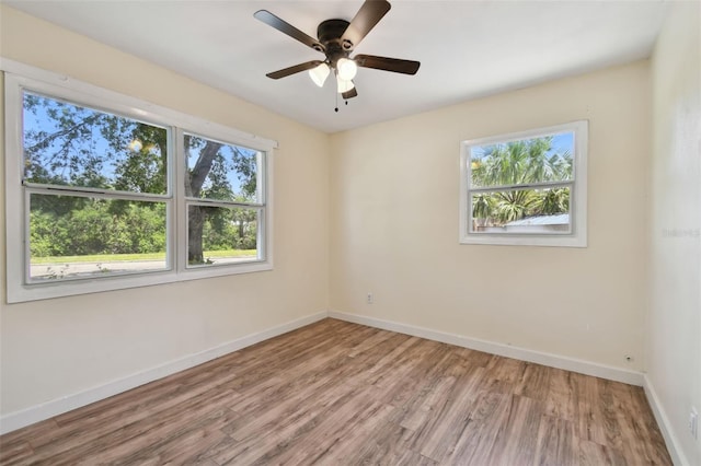 1810 77th Ave N, Saint Petersburg, FL 33702 - spare room with wood finished floors, baseboards, and ceiling fan