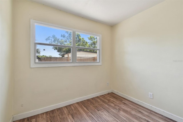 1810 77th Ave N, Saint Petersburg, FL 33702 - empty room with baseboards and wood finished floors