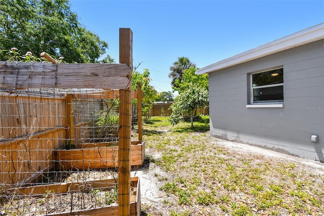 1810 77th Ave N, Saint Petersburg, FL 33702 - view of yard with fence and a garden