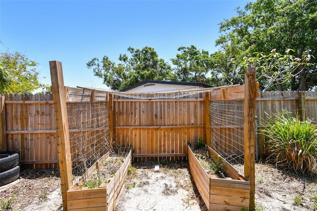 1810 77th Ave N, Saint Petersburg, FL 33702 - fenced backyard featuring a garden