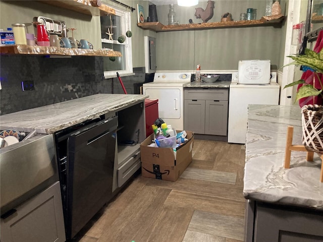 2912 Case Ave, Bradenton, FL 34207 - kitchen with open shelves, gray cabinetry, light countertops, washer and clothes dryer, and light wood finished floors