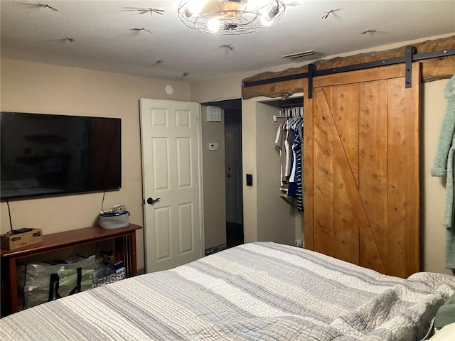 2912 Case Ave, Bradenton, FL 34207 - bedroom with a barn door and a closet