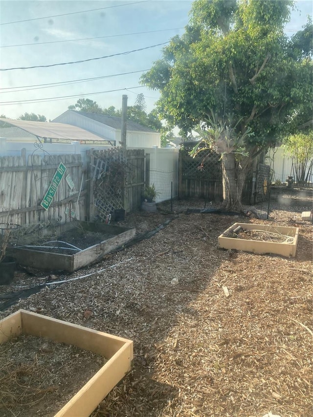 2912 Case Ave, Bradenton, FL 34207 - fenced backyard with a vegetable garden