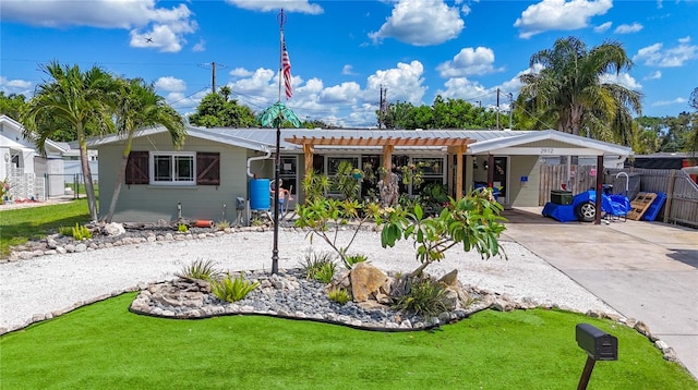 2912 Case Ave, Bradenton, FL 34207 - back of house with driveway, an attached carport, and a pergola