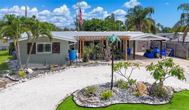 2912 Case Ave, Bradenton, FL 34207 - view of front facade featuring a carport, a metal roof, and driveway