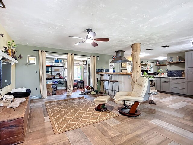 2912 Case Ave, Bradenton, FL 34207 - living room featuring a ceiling fan and light wood-style floors