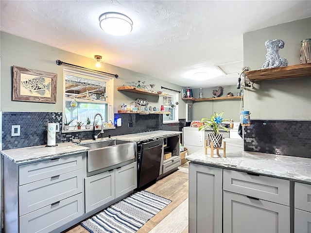 2912 Case Ave, Bradenton, FL 34207 - kitchen with open shelves, black dishwasher, and light stone counters