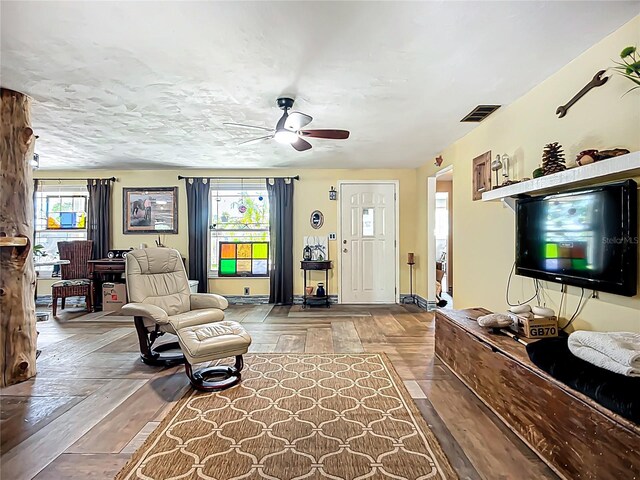 2912 Case Ave, Bradenton, FL 34207 - living area with healthy amount of natural light, a ceiling fan, and wood finished floors