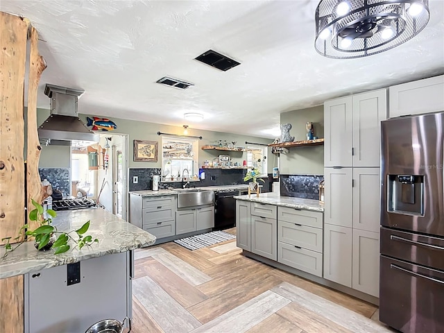 2912 Case Ave, Bradenton, FL 34207 - kitchen featuring stainless steel refrigerator with ice dispenser, exhaust hood, black dishwasher, open shelves, and gray cabinetry
