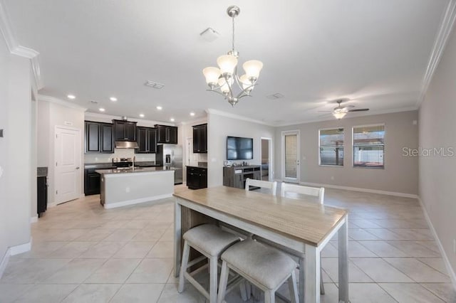 dining area featuring crown molding, light tile patterned floors, recessed lighting, a chandelier, and baseboards