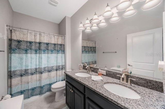 bathroom with toilet, double vanity, and curtained shower
