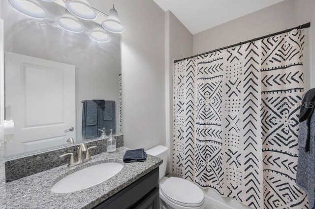 bathroom with toilet and vanity