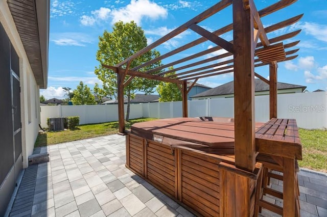 view of patio with a hot tub, cooling unit, a fenced backyard, and a pergola