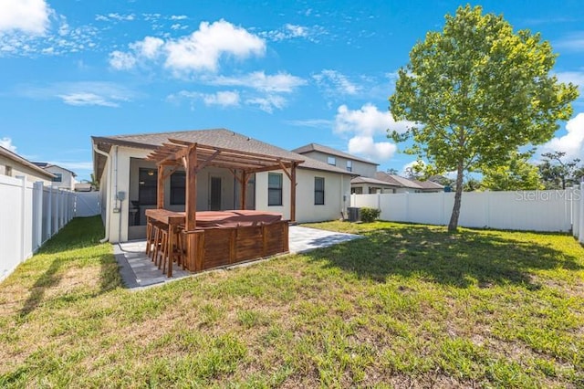 back of house with a hot tub, a pergola, a patio, and central AC