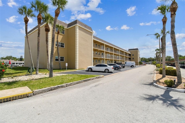 1 Boca Ciega Point Blvd Unit 310, Saint Petersburg, FL 33708 - view of building exterior with uncovered parking