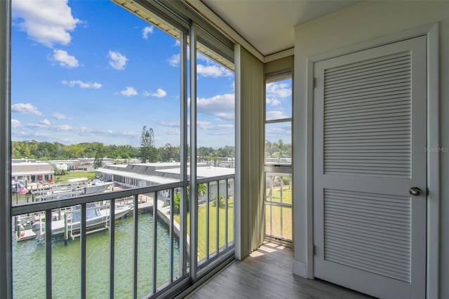 1 Boca Ciega Point Blvd Unit 310, Saint Petersburg, FL 33708 - unfurnished sunroom with healthy amount of natural light and a water view