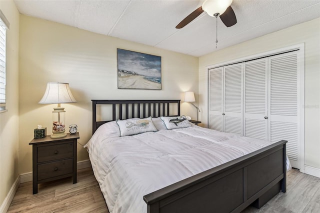 1 Boca Ciega Point Blvd Unit 310, Saint Petersburg, FL 33708 - bedroom featuring wood finished floors, a closet, baseboards, and ceiling fan