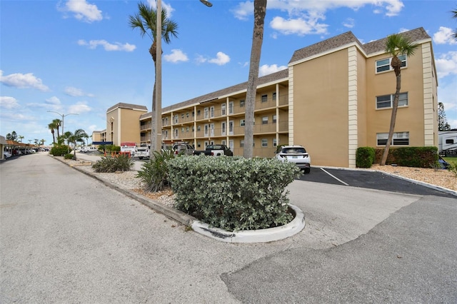 1 Boca Ciega Point Blvd Unit 310, Saint Petersburg, FL 33708 - view of apartment building / complex featuring uncovered parking