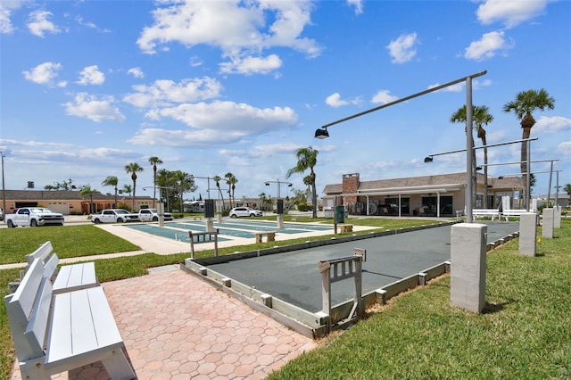 1 Boca Ciega Point Blvd Unit 310, Saint Petersburg, FL 33708 - view of property's community featuring a game area, shuffleboard, and a lawn