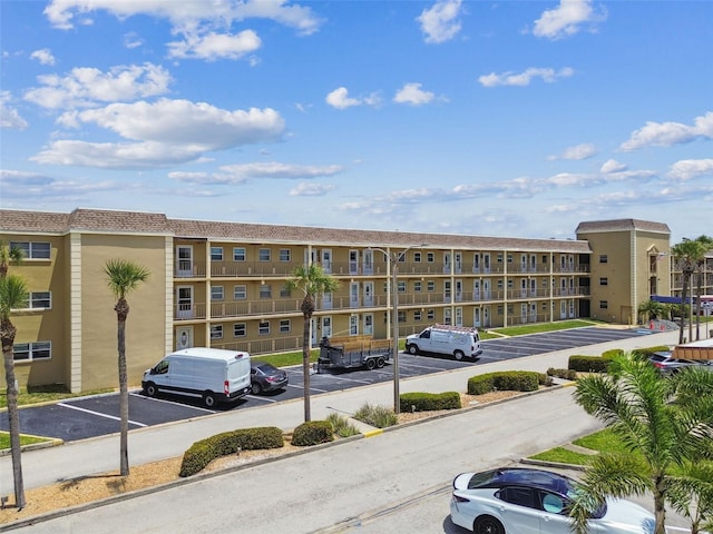 1 Boca Ciega Point Blvd Unit 310, Saint Petersburg, FL 33708 - view of apartment building / complex with uncovered parking