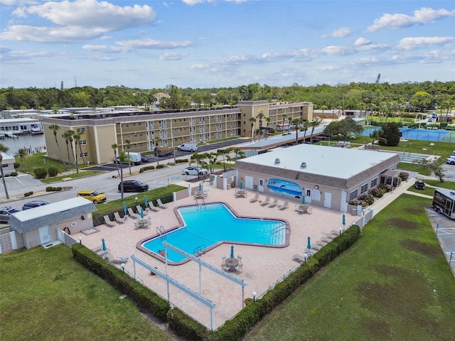 1 Boca Ciega Point Blvd Unit 310, Saint Petersburg, FL 33708 - community pool featuring a patio area and view of scattered trees
