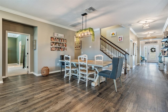 dining room featuring stairway, crown molding, dark wood-style floors, baseboards, and a chandelier