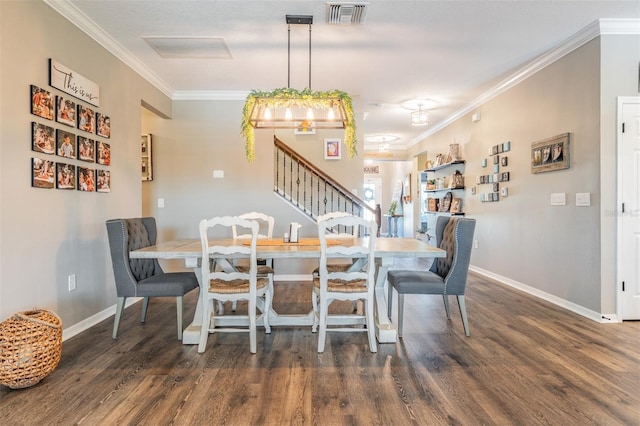 dining room featuring stairs, wood finished floors, crown molding, and baseboards
